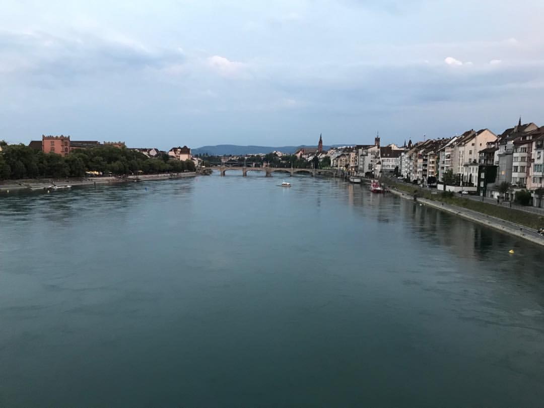 The Rhine River flowing through Basel, Switzerland, viewed from the riverbank